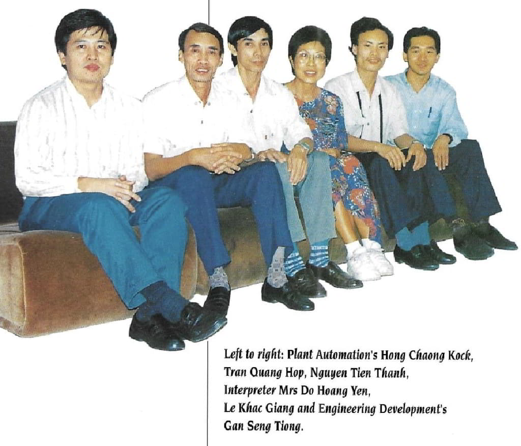 A group of people sitting on a couchDescription automatically generated